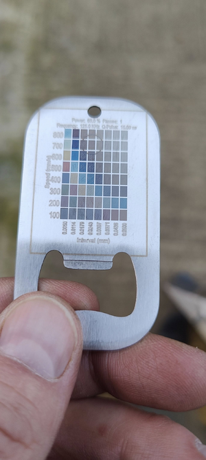 Colour frequency test sheet on stainless keyring.png